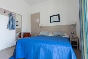 Postel nebo postele na pokoji v ubytování Hotel Olympia