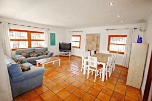 a living room with a couch and a table at Colibri - modern, well-equipped villa with private pool in Moraira in Moraira