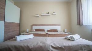 Posteľ alebo postele v izbe v ubytovaní Apartment Brijuni