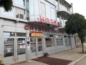 a hotel with a sign on the front of it at HOTEL Crystal Lights in Pirot