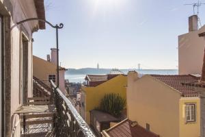 a view of the city from the balcony of a building at Chiado Blue by Homing in Lisbon