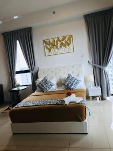 Studio I-Soho D'Gunduls Homestay by DGH I-CITY客房内的一张或多张床位
