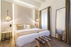 Een bed of bedden in een kamer bij ICON Rosetó