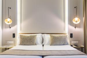 Een bed of bedden in een kamer bij ICON Rosetó