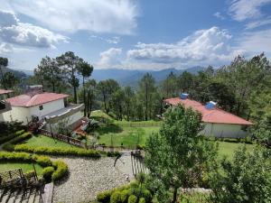 an aerial view of a house and a garden at Boros Resorts Binsar in Almora