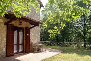 a table and chairs sitting outside of a building at Agriturismo Cavalierino in Montepulciano