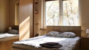 Ένα ή περισσότερα κρεβάτια σε δωμάτιο στο ESEN Apartamenty Centrum