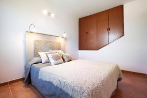 Posteľ alebo postele v izbe v ubytovaní Casa Ariadna