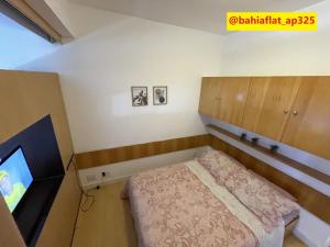Ένα ή περισσότερα κρεβάτια σε δωμάτιο στο Flat à Beira Mar na Barra