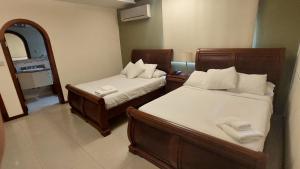 Voodi või voodid majutusasutuse Hotel Voyager Manta toas