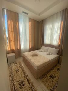 Ένα ή περισσότερα κρεβάτια σε δωμάτιο στο KU&NA HOTEL BELSH