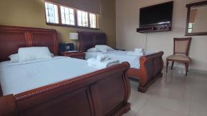 Voodi või voodid majutusasutuse Hotel Voyager Manta toas