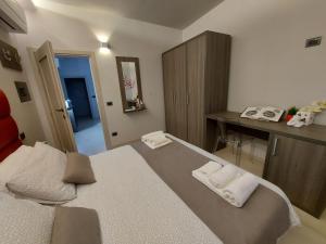 Postel nebo postele na pokoji v ubytování Casa Vacanze Piccolpasso 20