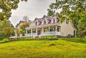 a large white house with a purple roof at Mammoth Cave Rental on 50 Acres Shared Amenities in Cub Run