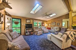 a living room with a couch and chairs and a tv at Scenic Spring Mills Escape Swim, Fish, Hike! in Spring Mills
