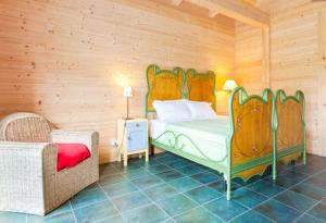 Tempat tidur dalam kamar di I Conti della Serva