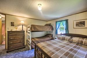 a bedroom with two bunk beds and a dresser at Scenic Spring Mills Escape Swim, Fish, Hike! in Spring Mills