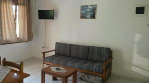 a living room with a couch and a table at Villa Sophia in Ofrínion