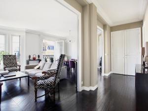 a living room with a couch and chairs at Outstanding 2 bedrooms with a terrific Eiffel Tower view in Paris +17 photos