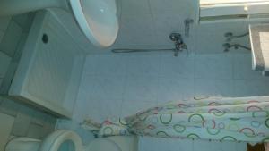 a bathroom with a toilet and a sink at Villa Sophia in Ofrínion +17 photos