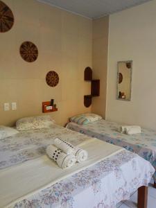 Кровать или кровати в номере Estalagem Sol de Boipeba