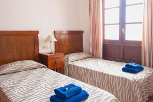 Postel nebo postele na pokoji v ubytování Blancazul Cala Azul