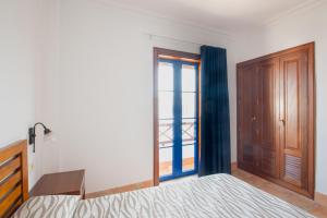Postel nebo postele na pokoji v ubytování Blancazul Cala Azul