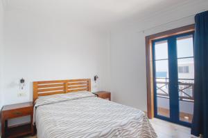 Postel nebo postele na pokoji v ubytování Blancazul Cala Azul
