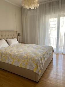 Postel nebo postele na pokoji v ubytování CasaGreek Kato Patissia-Athens