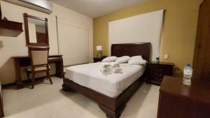 Voodi või voodid majutusasutuse Hotel Voyager Manta toas
