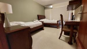 Voodi või voodid majutusasutuse Hotel Voyager Manta toas