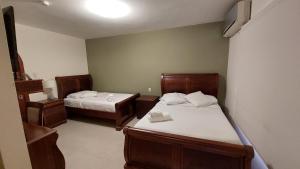 Voodi või voodid majutusasutuse Hotel Voyager Manta toas