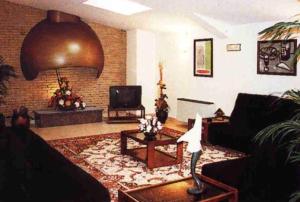 a living room with a couch and a table at Hotel La Seu in La Seu d'Urgell
