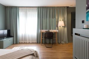 Cama o camas de una habitación en Hostellerie du Grünewald