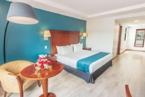 Postel nebo postele na pokoji v ubytování Sonesta Hotel Loja + 19 fotografií