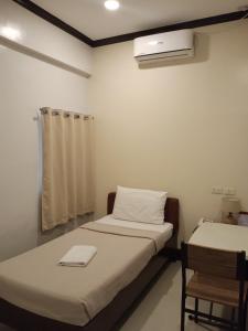 Postel nebo postele na pokoji v ubytování AB Star Suites