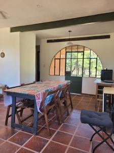 a dining room with a table and some chairs at Casa de campo in Santa María +11 photos