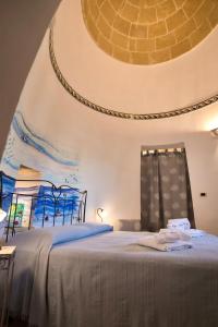 A bed or beds in a room at Magico Salento 1/2/3