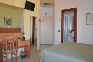 TV a/nebo společenská místnost v ubytování Hotel Cristina