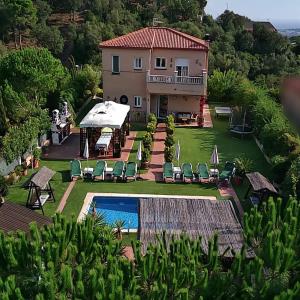 an aerial view of a house with a swimming pool at Holiday Home Cardona in Lloret de Mar