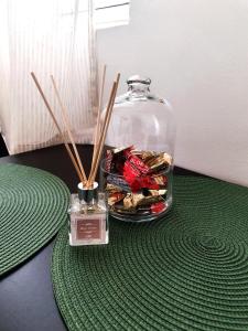 a glass jar with snacks in it on a table at Top Secret in Arandjelovac