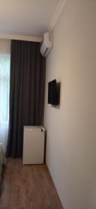 TV a/nebo společenská místnost v ubytování Hotel Posta Khulo