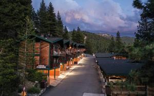 a row of buildings on a street with trees at Tahoe Chaparral in Incline Village