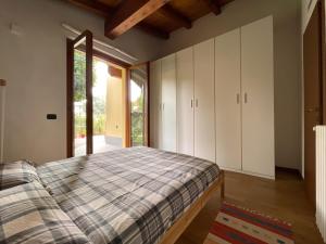 Katil atau katil-katil dalam bilik di Entire accommodation with private garden near Milan and Lake Como - Free parking - Family friendly