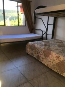 Postel nebo postele na pokoji v ubytování APARTAHOTEL TAYAMBE