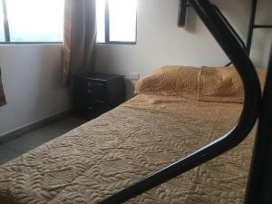 Postel nebo postele na pokoji v ubytování APARTAHOTEL TAYAMBE