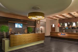 A television and/or entertainment centre at Aska Lara Resort & Spa Hotel