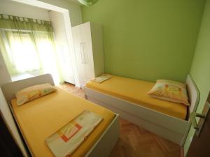 A bed or beds in a room at Apartment Sladojevic