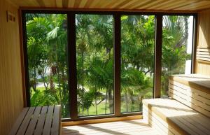 a room with a window with a bench and palm trees at Hotel La Croix in Honolulu +281 photos