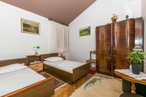 Postel nebo postele na pokoji v ubytování Apartments Neno
